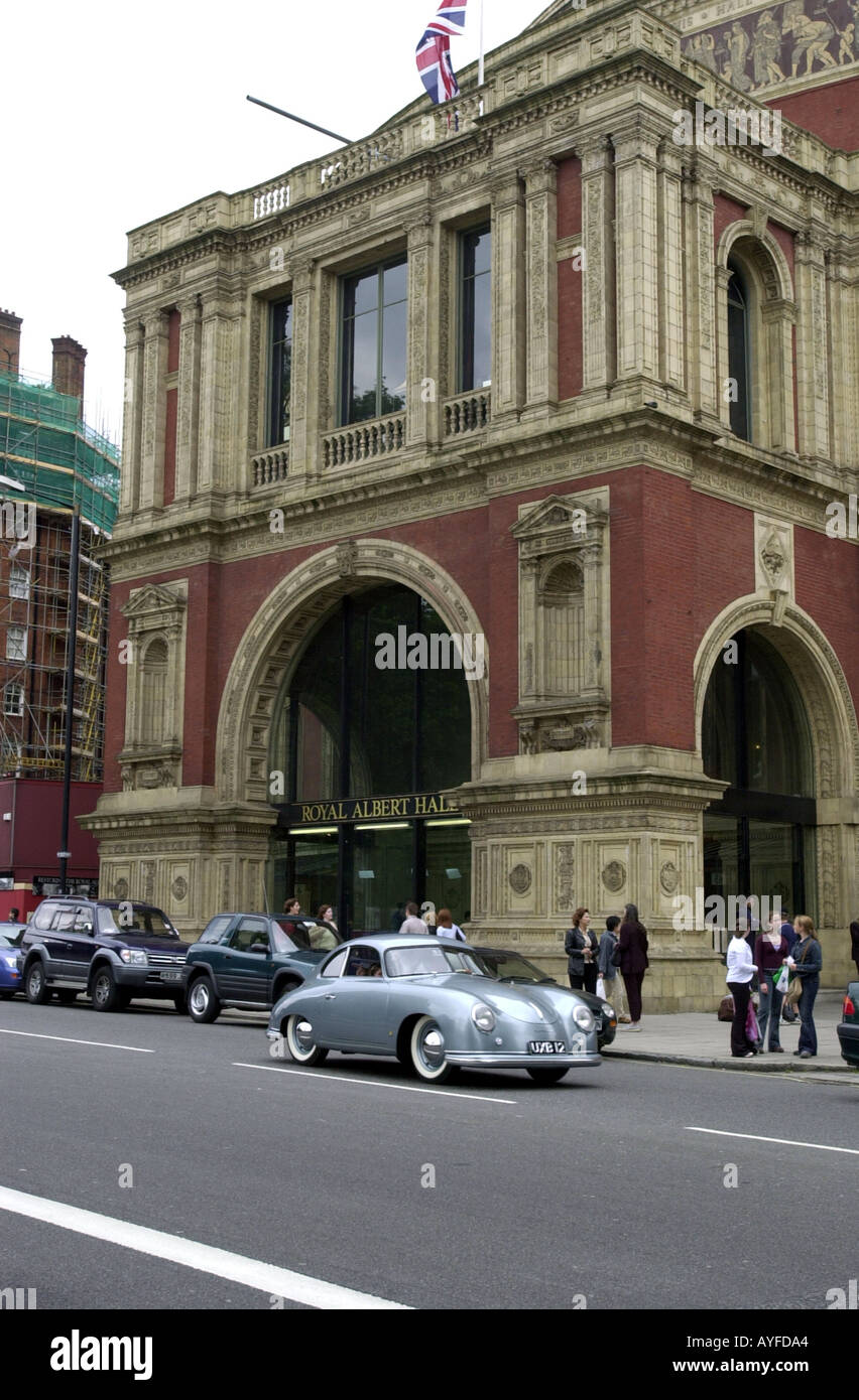Vintage Porsche car drives past the Albert Hall in London UK Stock Photo