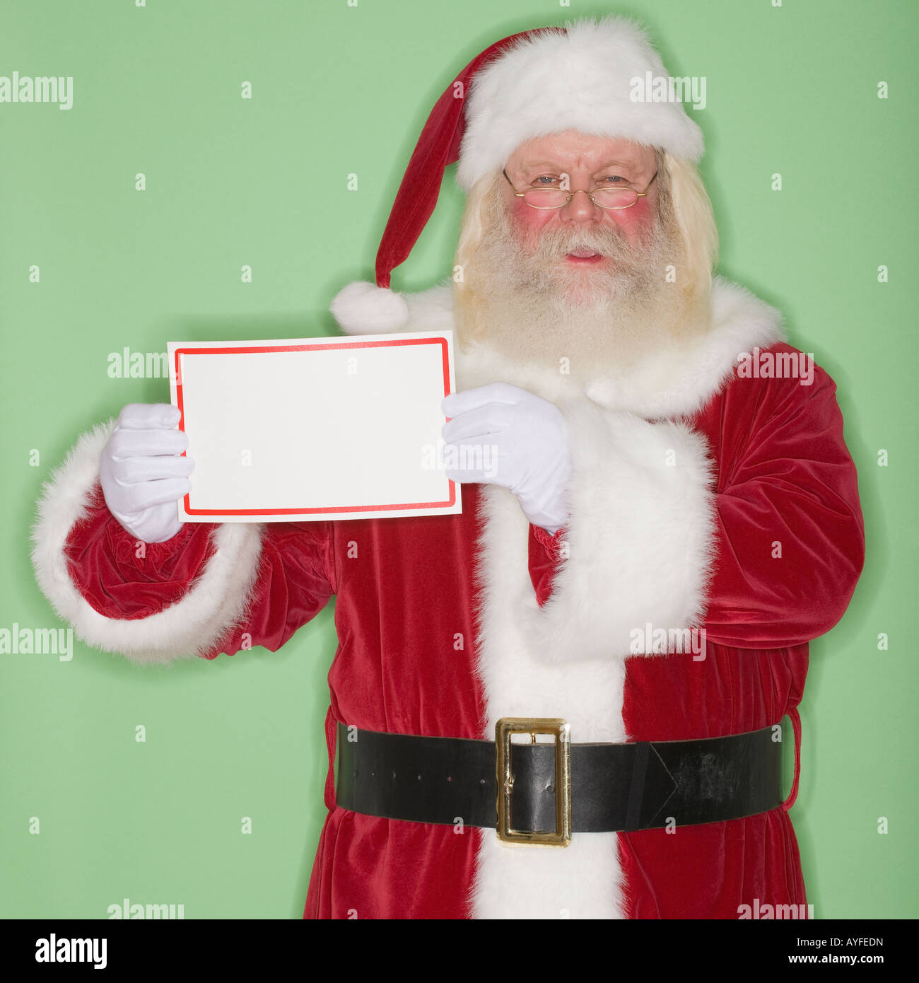 Santa Claus holding blank sign Stock Photo - Alamy