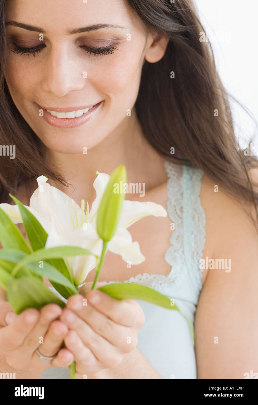 Woman holding flower Stock Photo Alamy