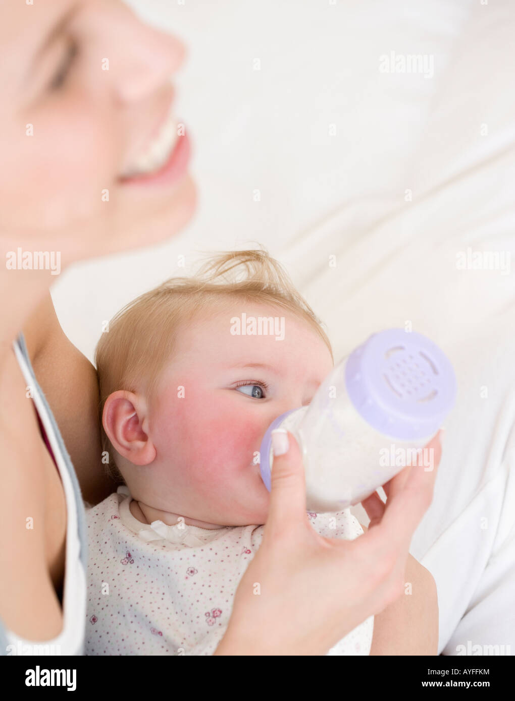 Mother feeding baby with bottle Stock Photo Alamy