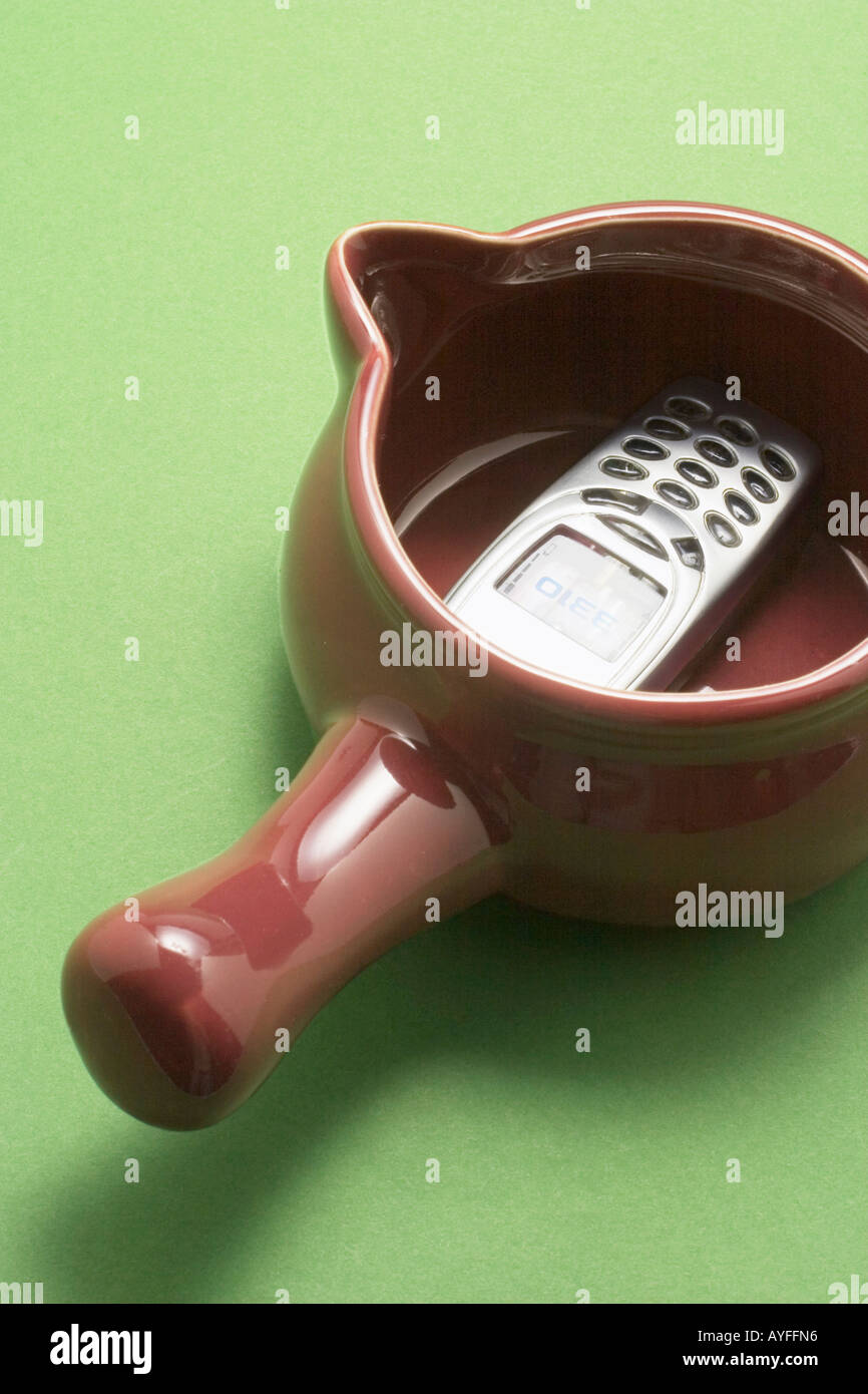 Mobile Phone in Saucepan Stock Photo
