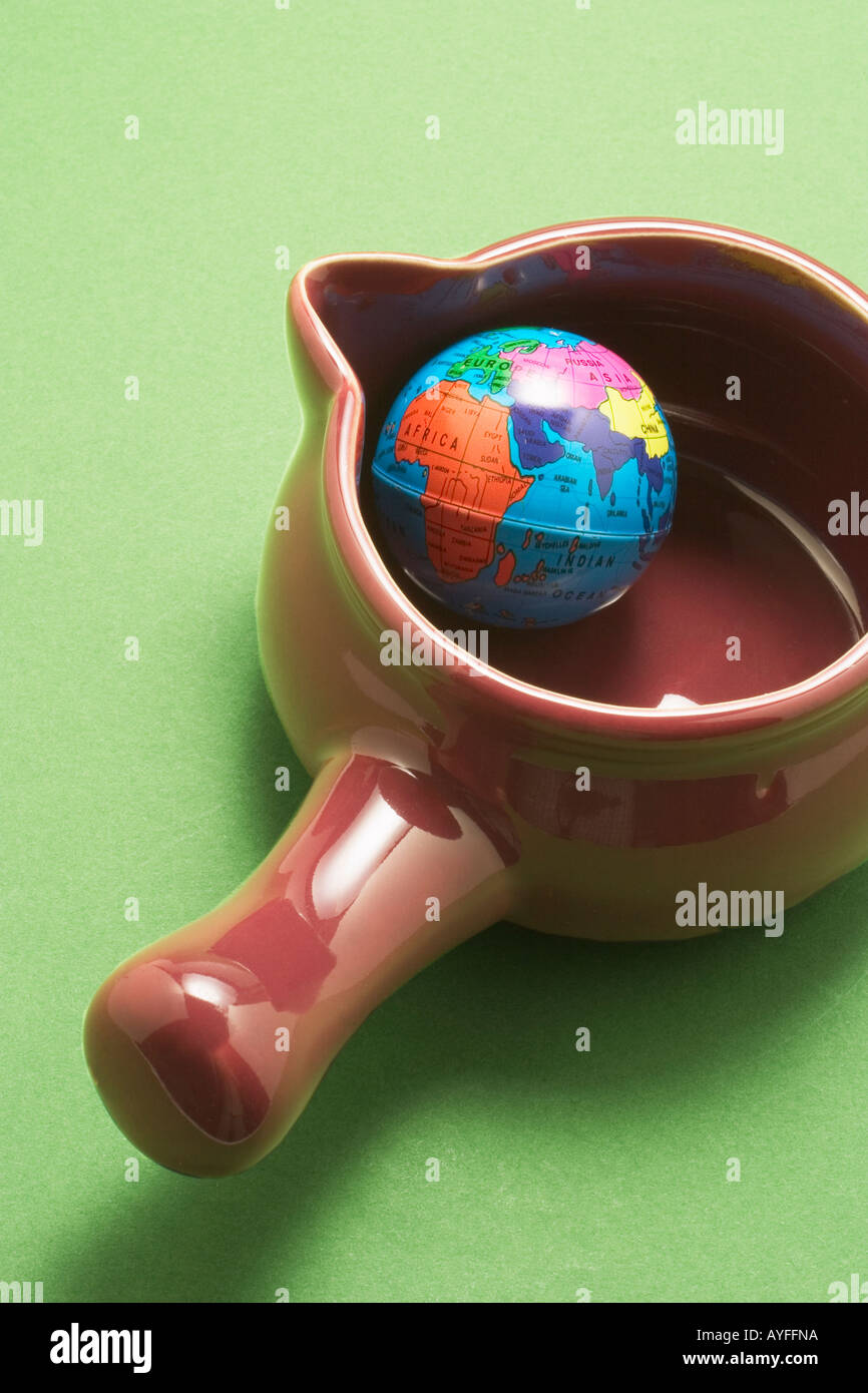 Globe in Saucepan Stock Photo