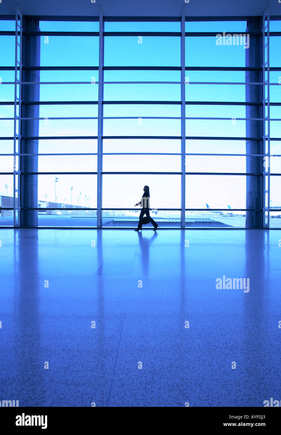 Businesswoman walking at airport Stock Photo