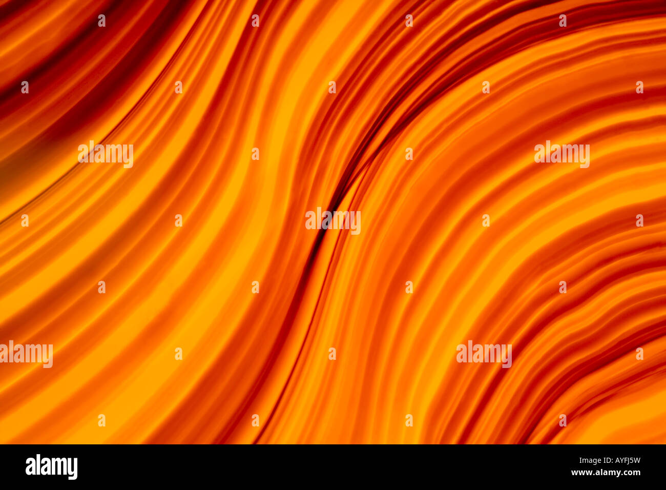 Glass abstract that looks like flowing hot lava. Stock Photo