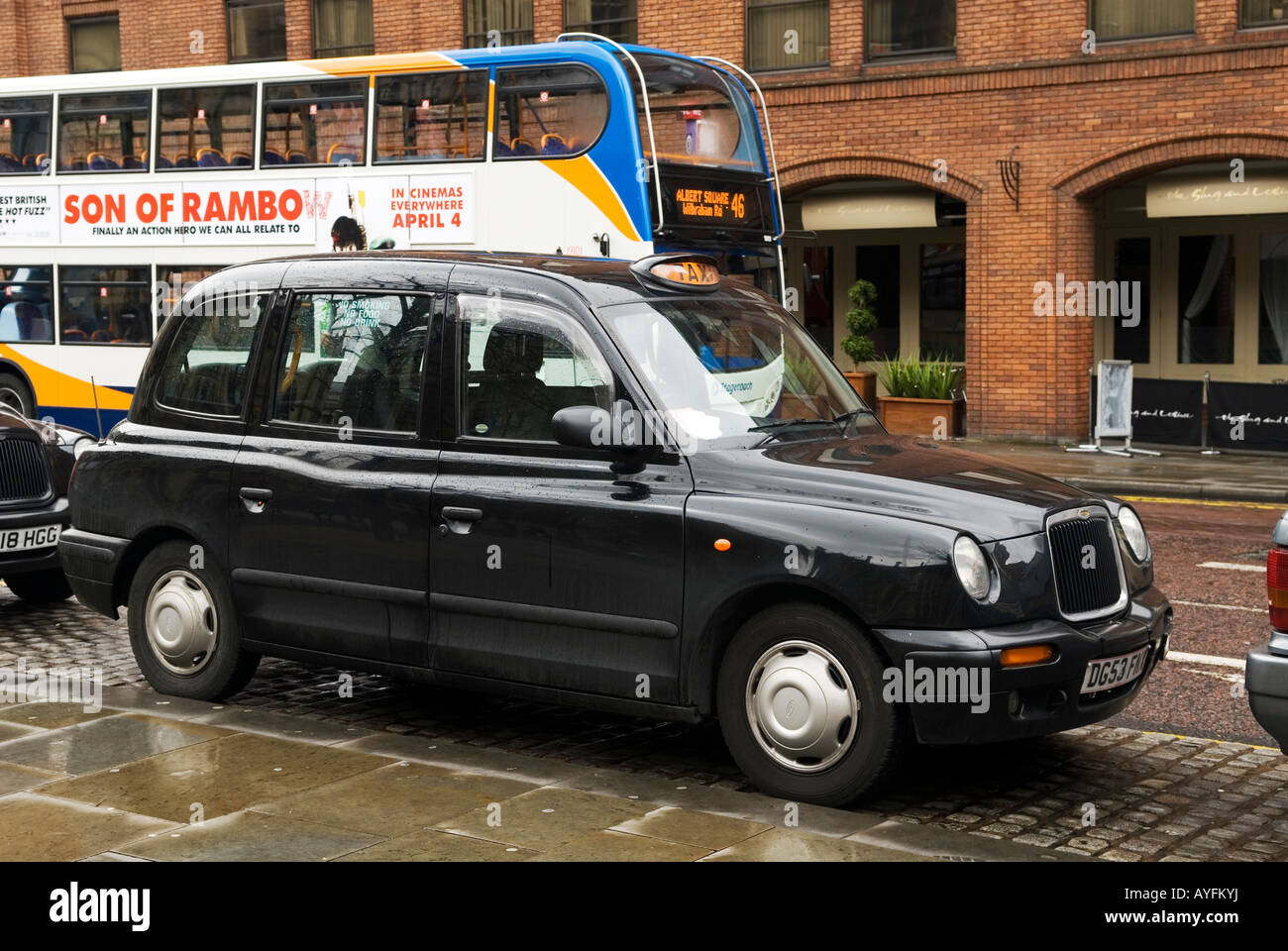 Black taxi cap Manchester UK Stock Photo