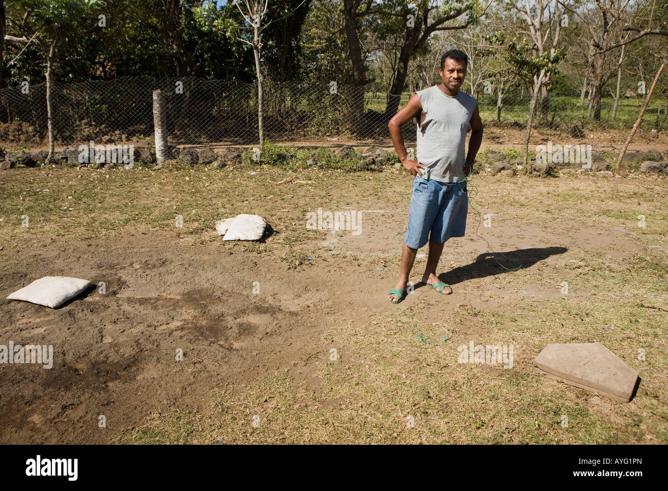 Man laying out field for Sunday baseball game Ometepe Island Nicaragua Stock Photo