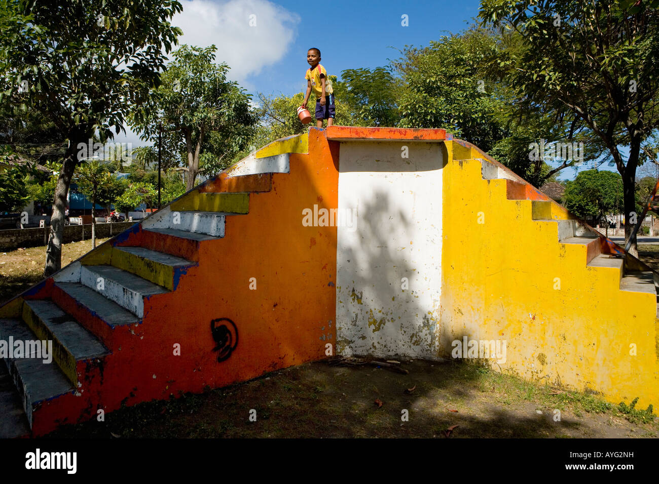 Boy playing on colorful slide Altagracia Ometepe Island Nicaragua Stock Photo