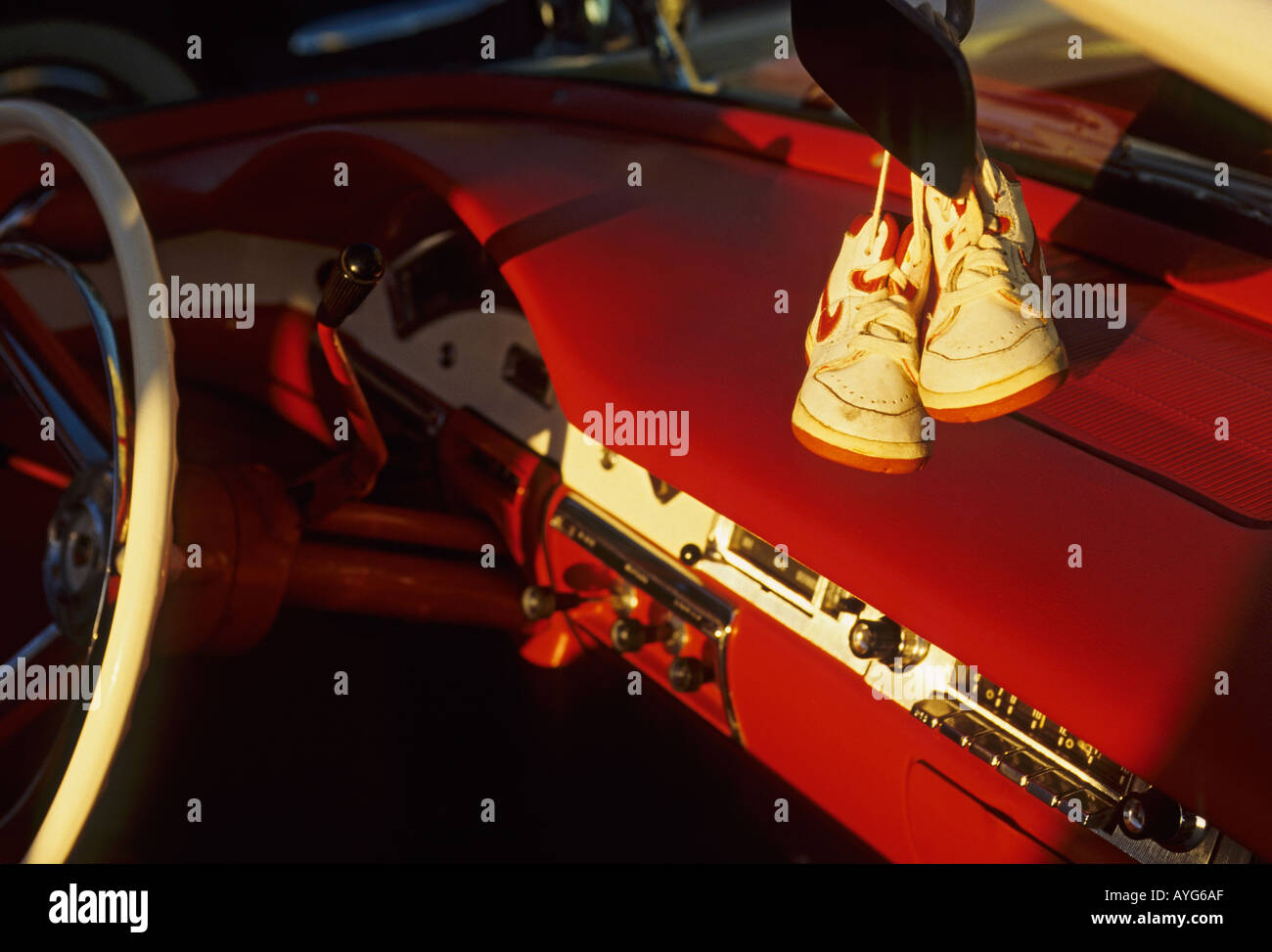 Americana automobile baby shoes hanging from rearview mirror of 1960 s