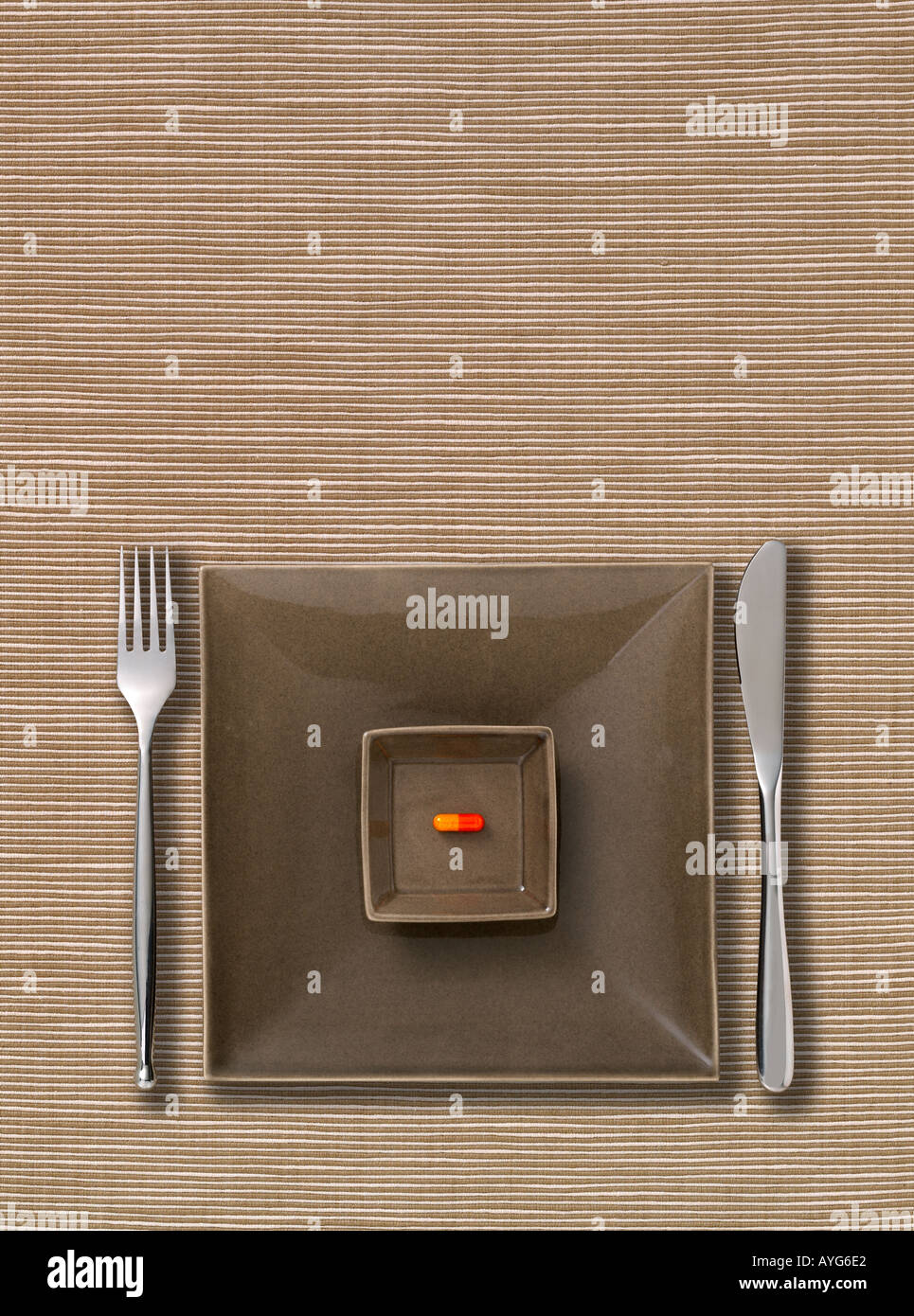 Place setting with a pill Stock Photo