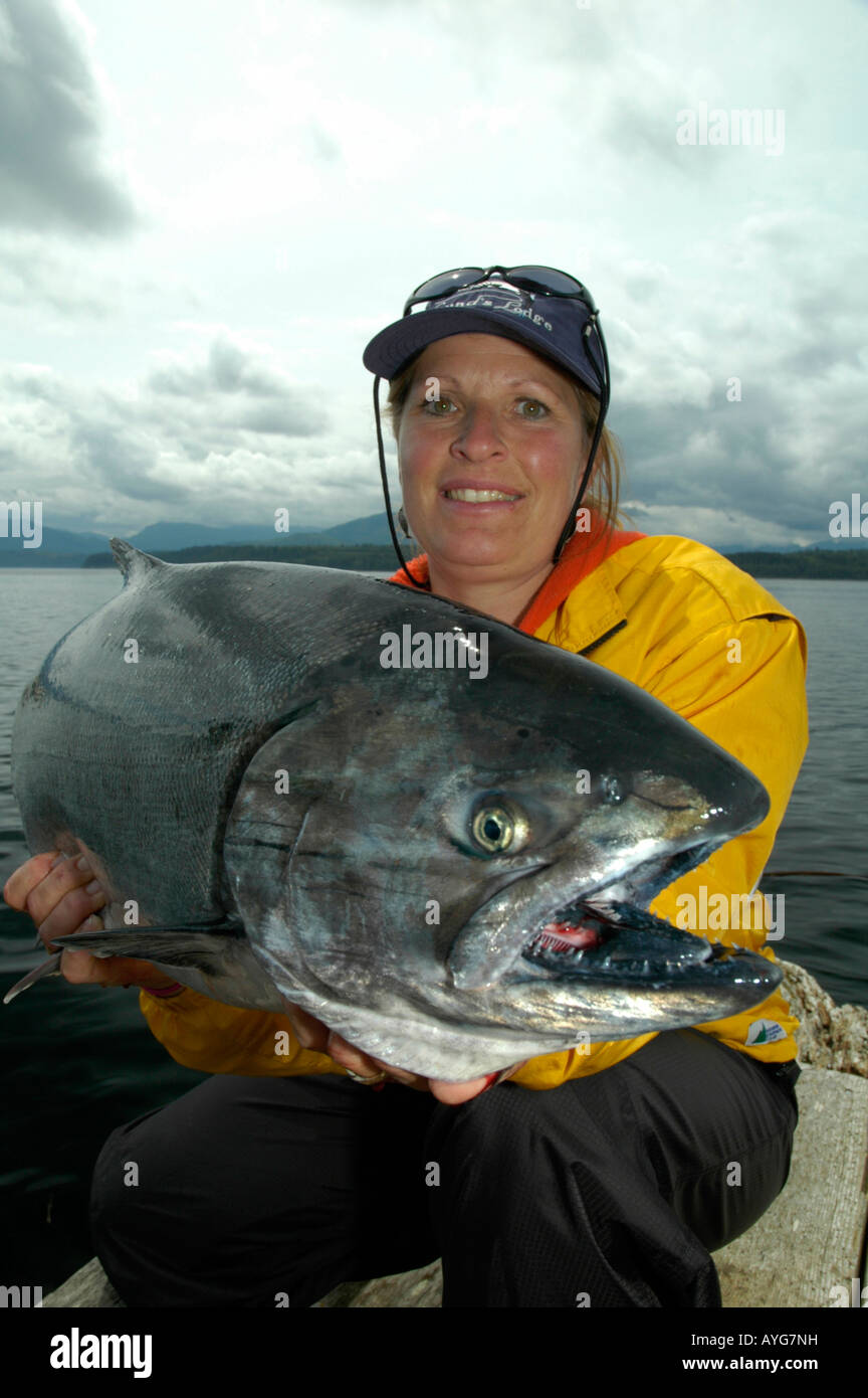 lady holding salmon Stock Photo