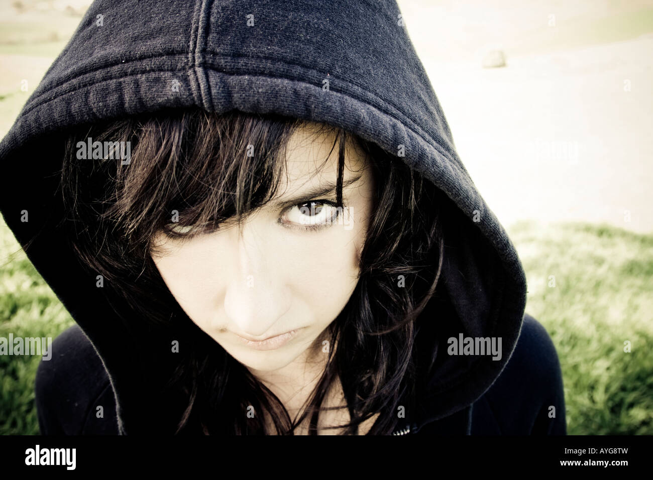 Scary young woman staring at camera Stock Photo