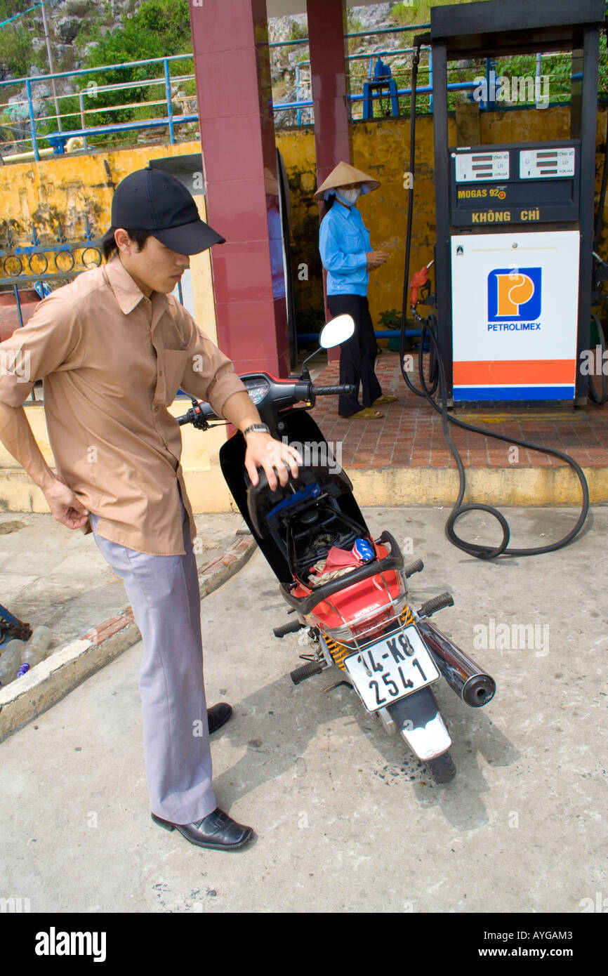 Filling up Motorbikes with Gasoline at Gas Station Pumps CatBa Halong Bay Vietnam Stock Photo