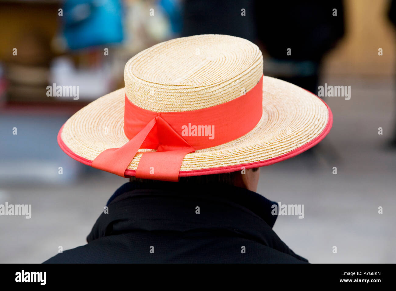 Gondolier wearing his distinctive boater hat Venice Italy Stock Photo