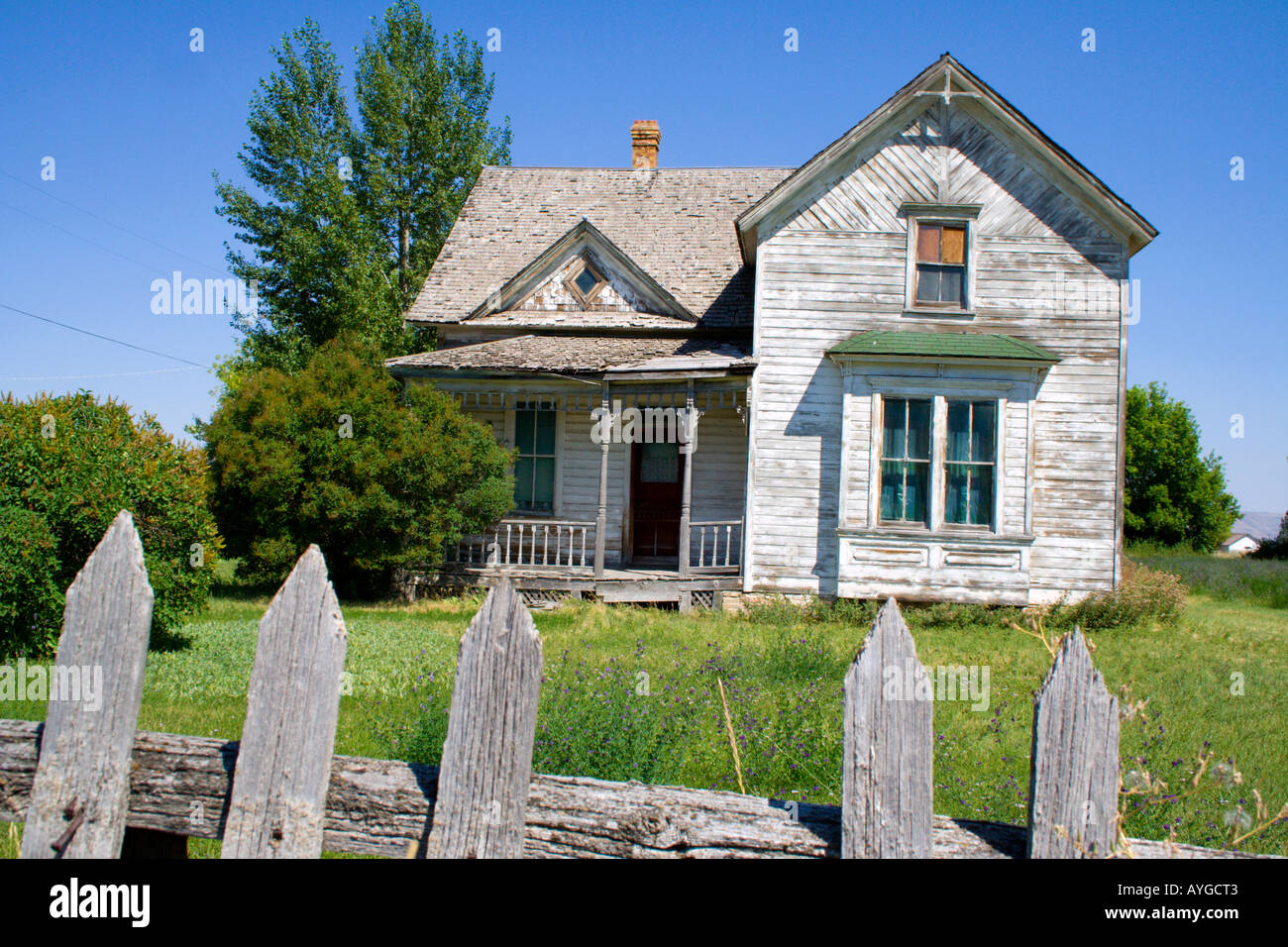 Old Americana wooden house with a large grass lawn Paris Idaho USA Stock Photo