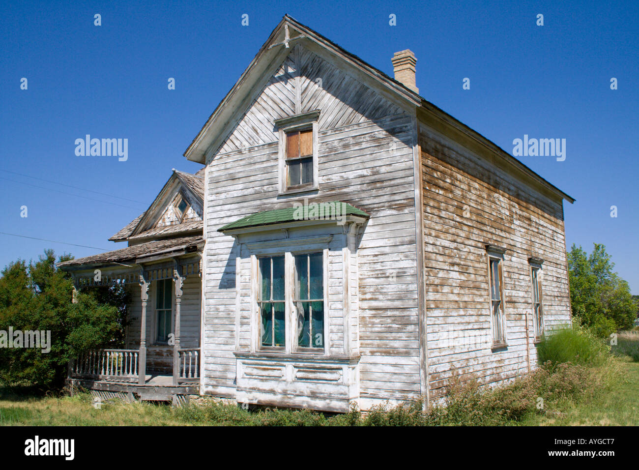 Old Americana wooden house with a large grass lawn Paris Idaho USA