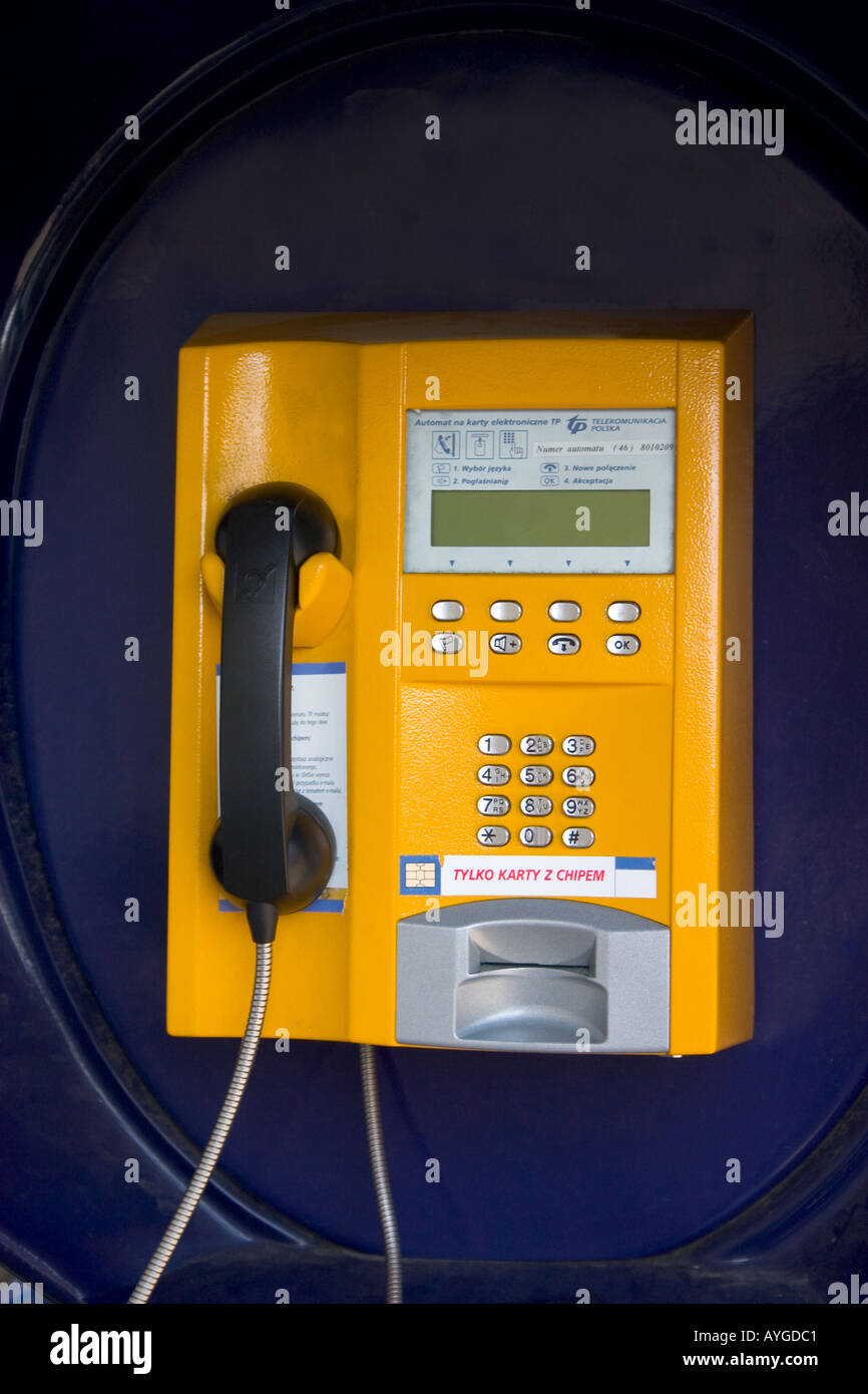 Polish yellow public telephone circa 2004. Rawa Mazowiecka Poland Stock Photo