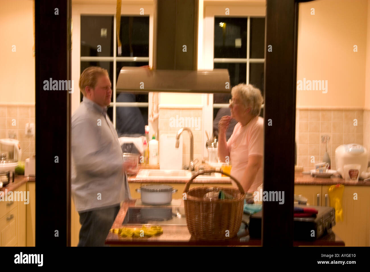 Grandson and grandmother talking in the kitchen Zawady Poland Stock Photo