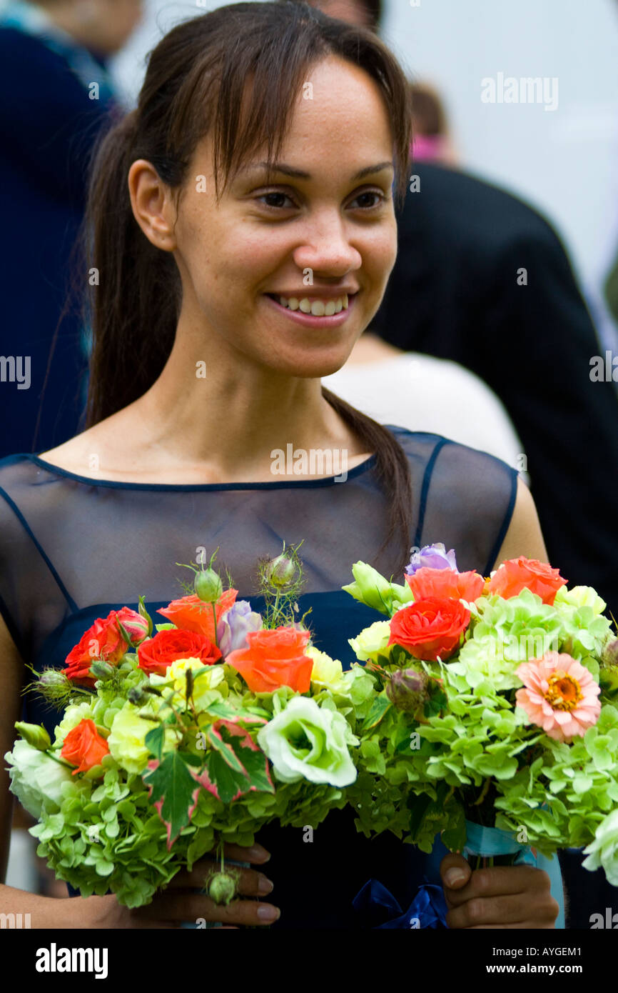 Bridesmaid holding the Flowers and smiling Stock Photo