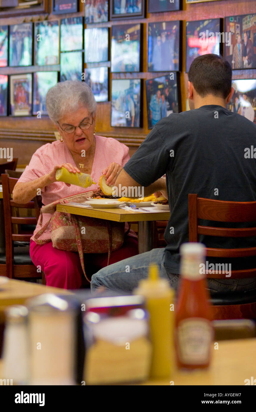 Customers enjoying a sandwich inside the famous Katz delicatessen New
