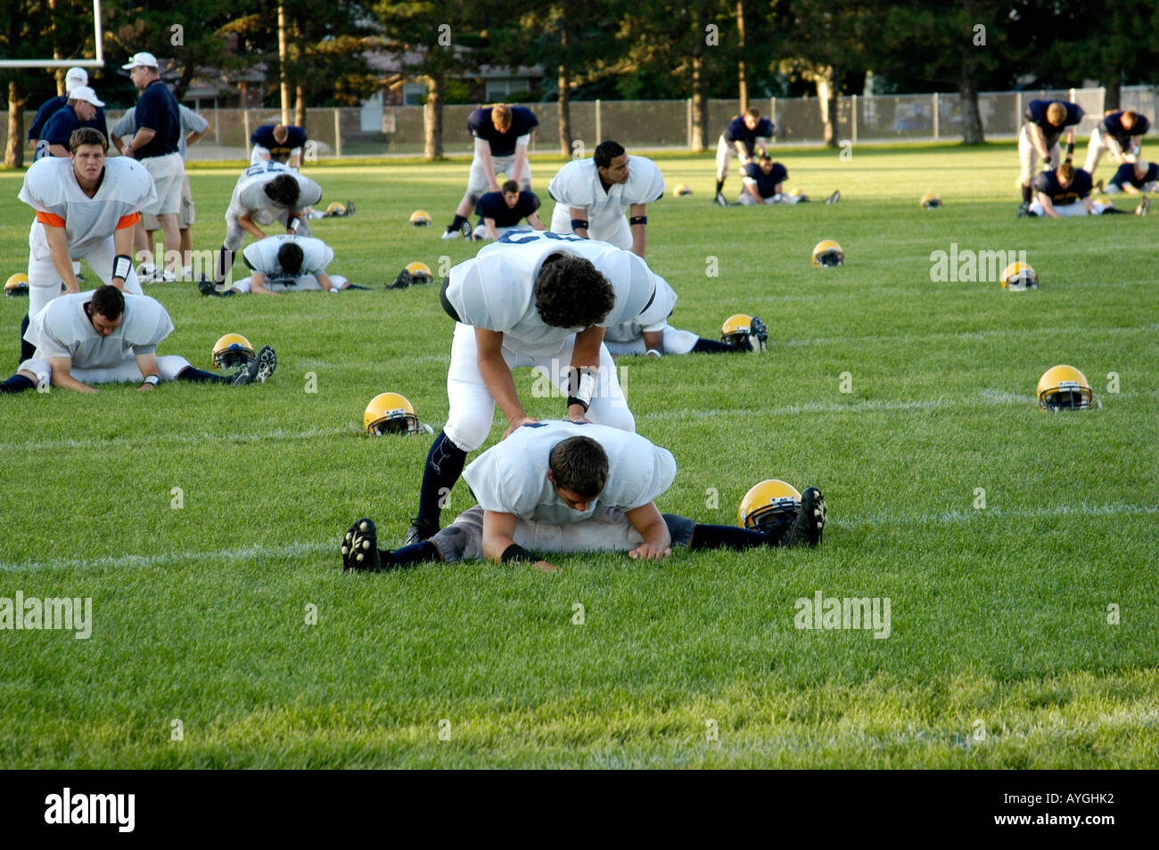 Football players warm up with exercises before playing in a game Stock