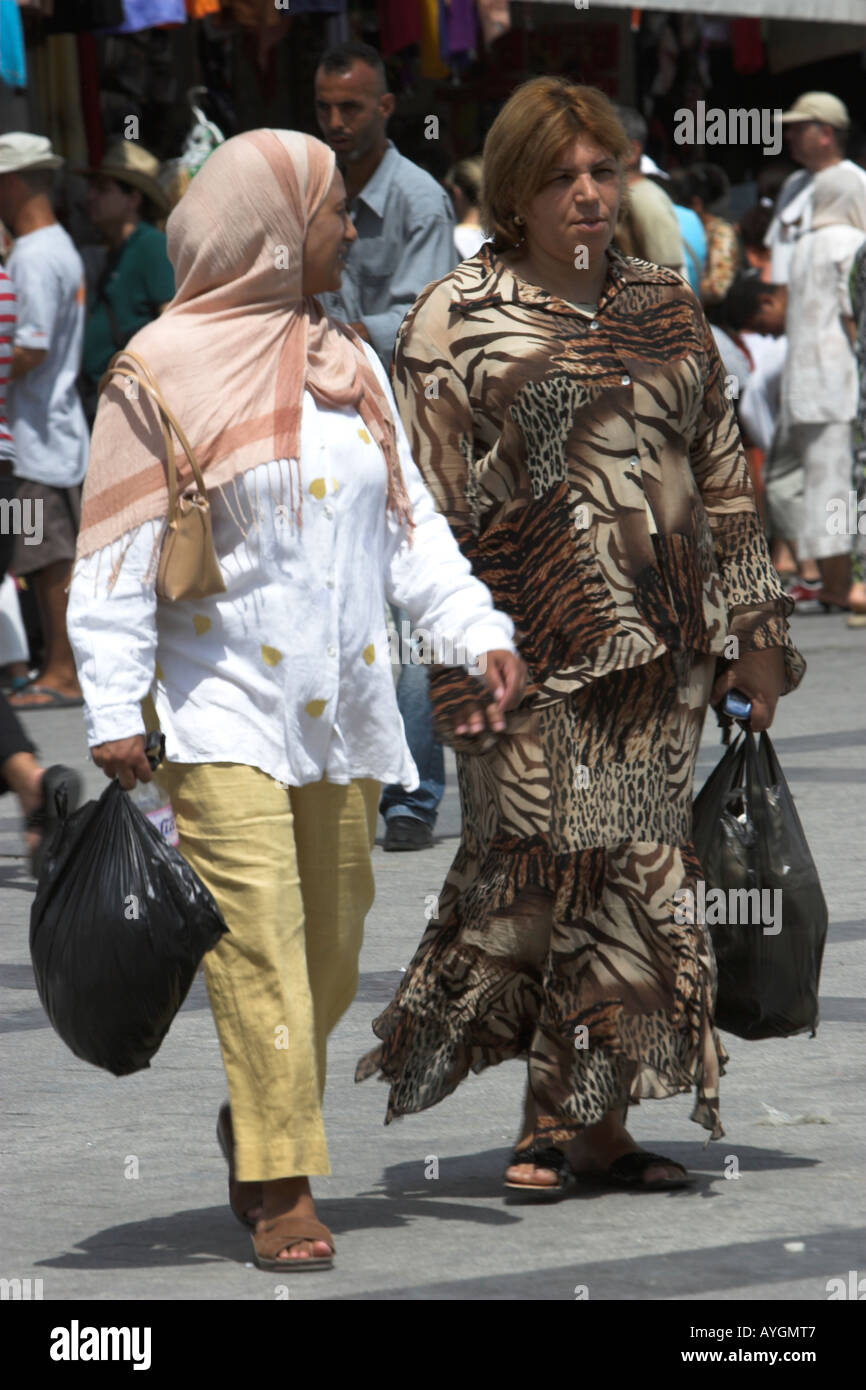 Women in taditional and contemporary clothes on Place del la Victoire the Medina Tunis Tunisia Stock Photo