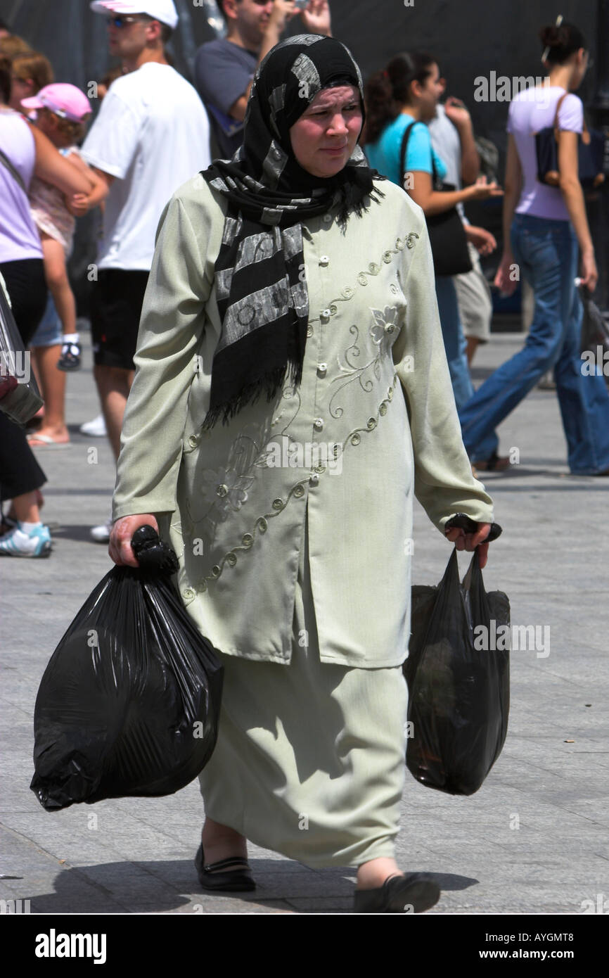 Woman with two shopping bags on Place del la Victoire the Medina Tunis Tunisia Stock Photo