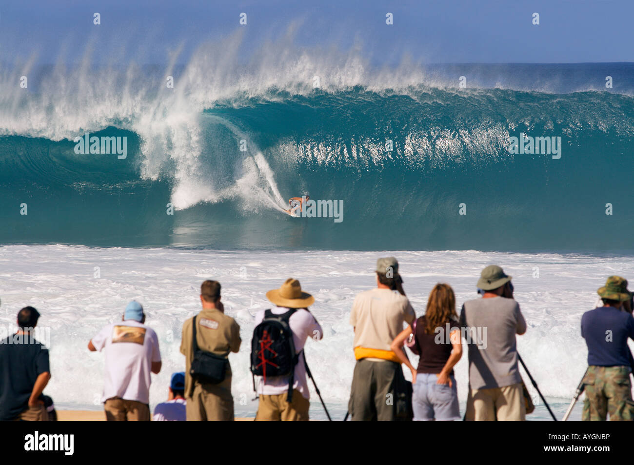 Surfer on a classic big barreling surfing wave at the Banzai Pipeline