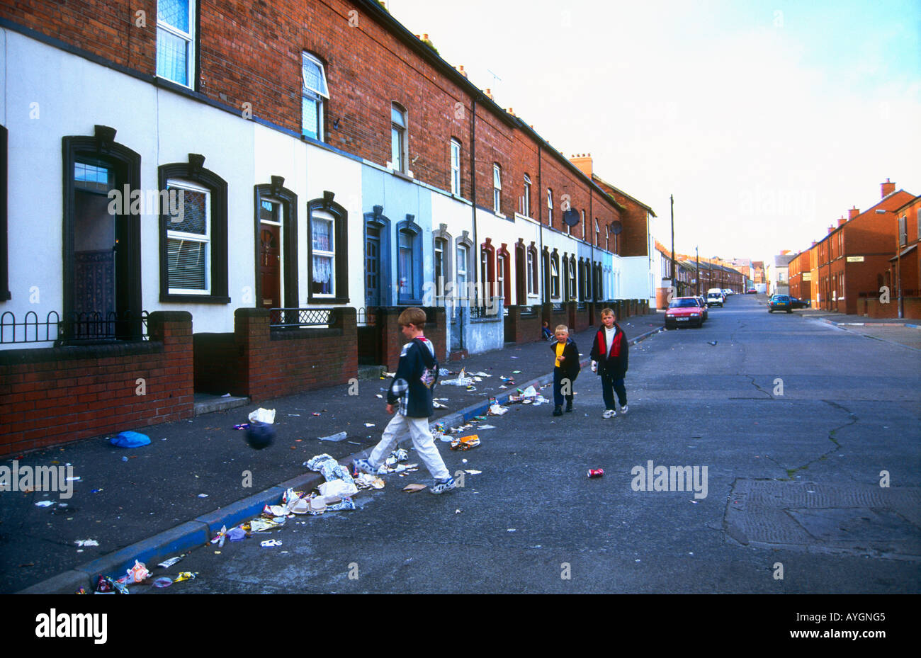 Street kids playing in the Shankhill road precinct of West Belfast Northern Ireland Stock Photo