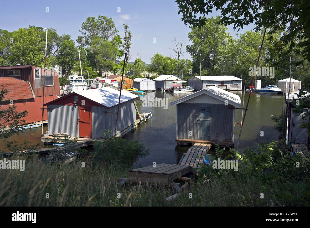 Boats and floating weekend shacks on Mississippi River backwater Winona Minnesota USA Stock Photo