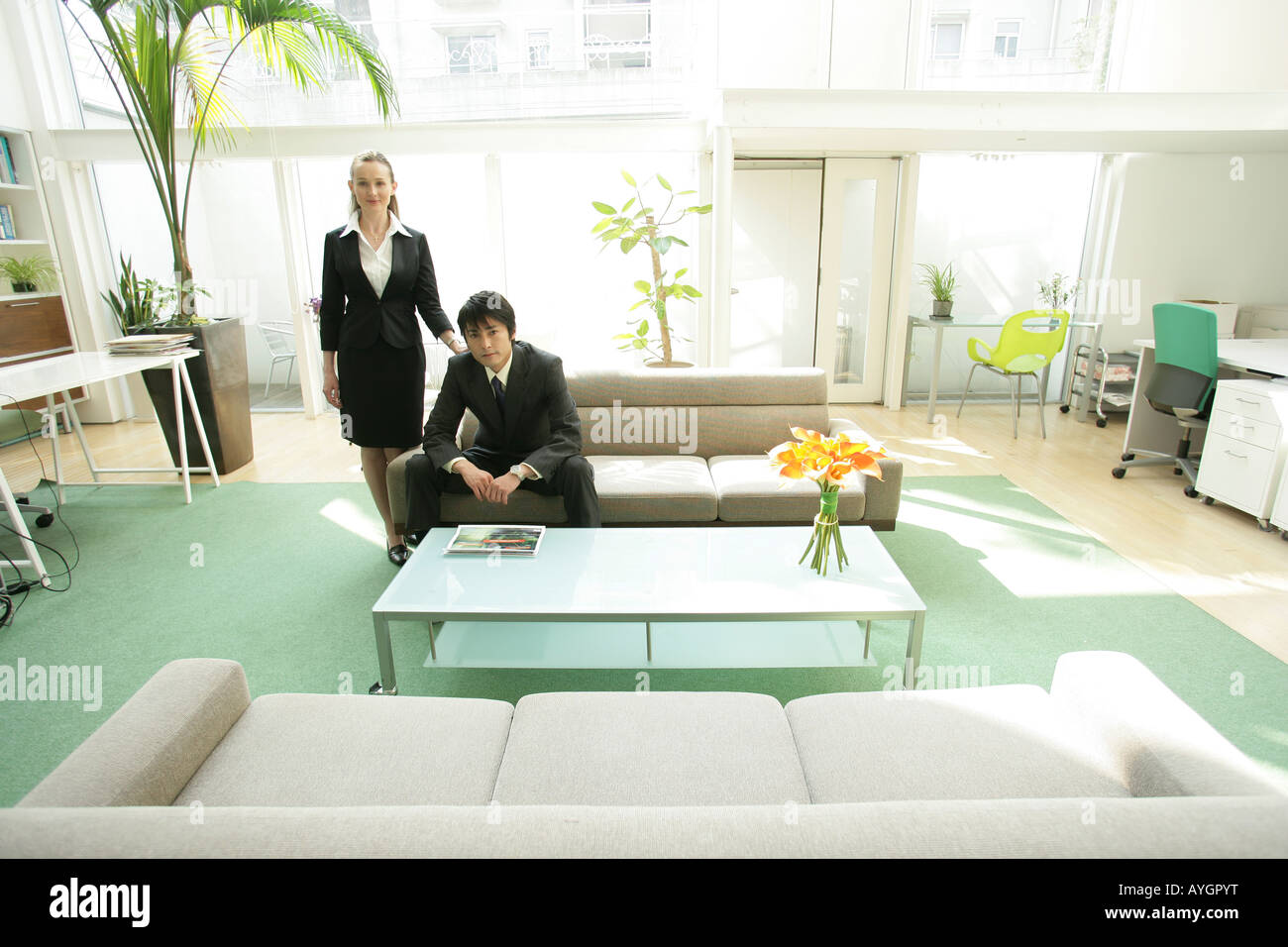 Portrait of businessman and businesswoman in office Stock Photo - Alamy