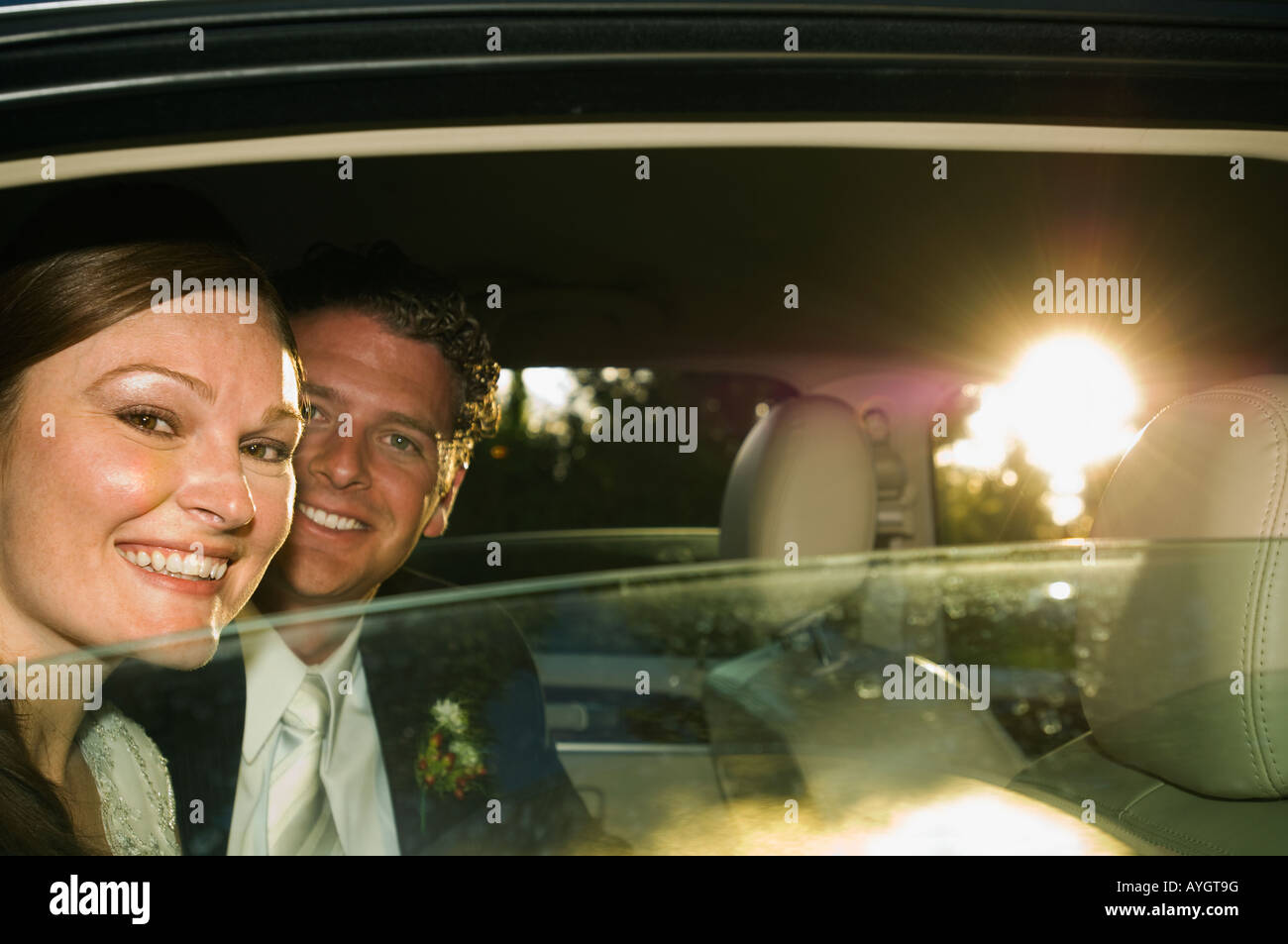 Bride and groom in limousine Stock Photo - Alamy