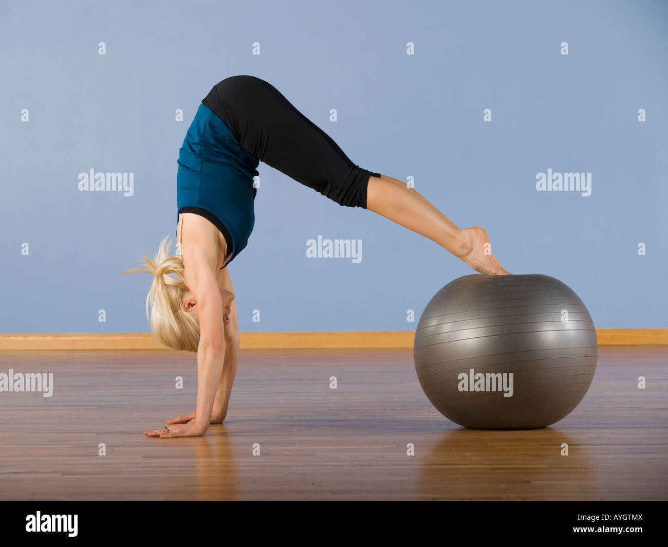 Woman exercising with ball Stock Photo