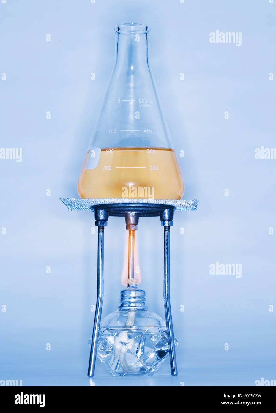 Beaker with liquid on alcohol burner Stock Photo