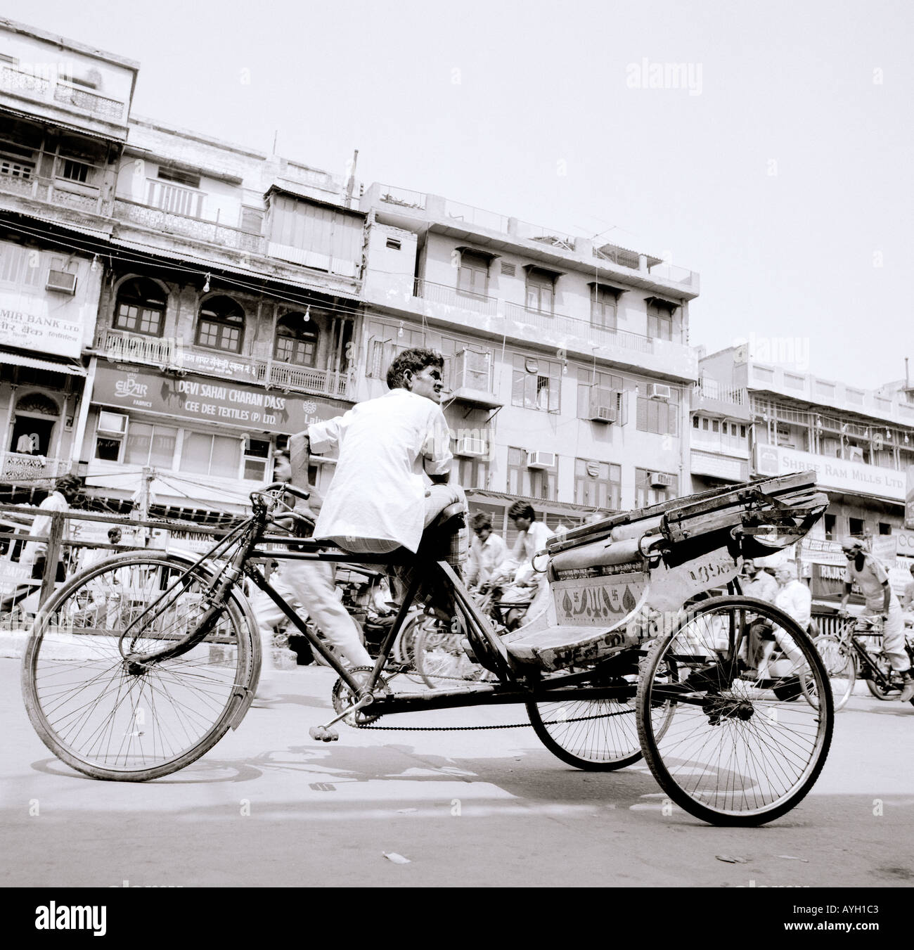 Rickshaw driver in Chandni Chowk in New Delhi in India in South Asia. Life Lifestyle Work City Cities Urban Poverty Slum Reportage Travel Stock Photo