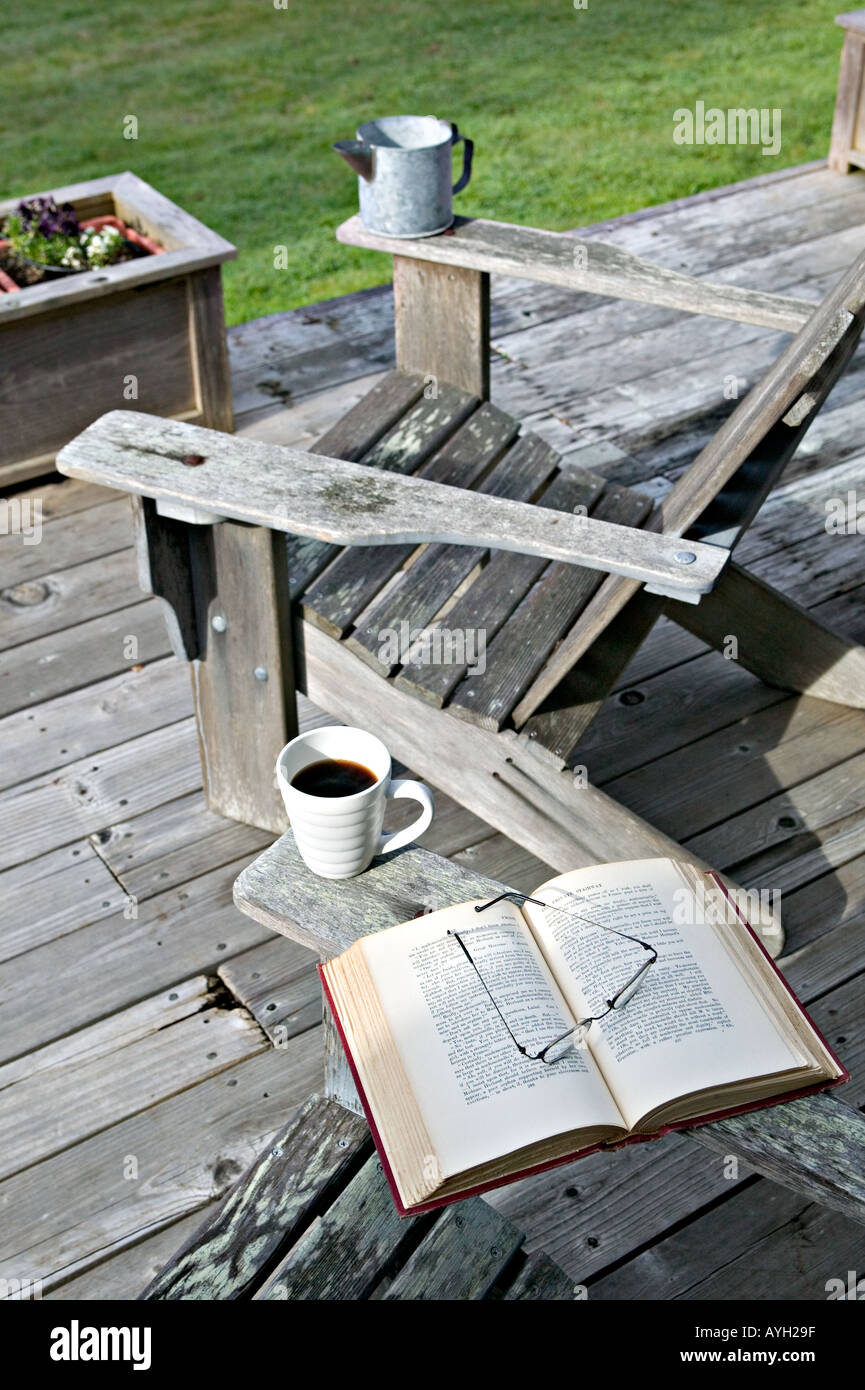 A peaceful morning for coffee and a book on the deck of a cabin along the Pacific Ocean in central California Stock Photo