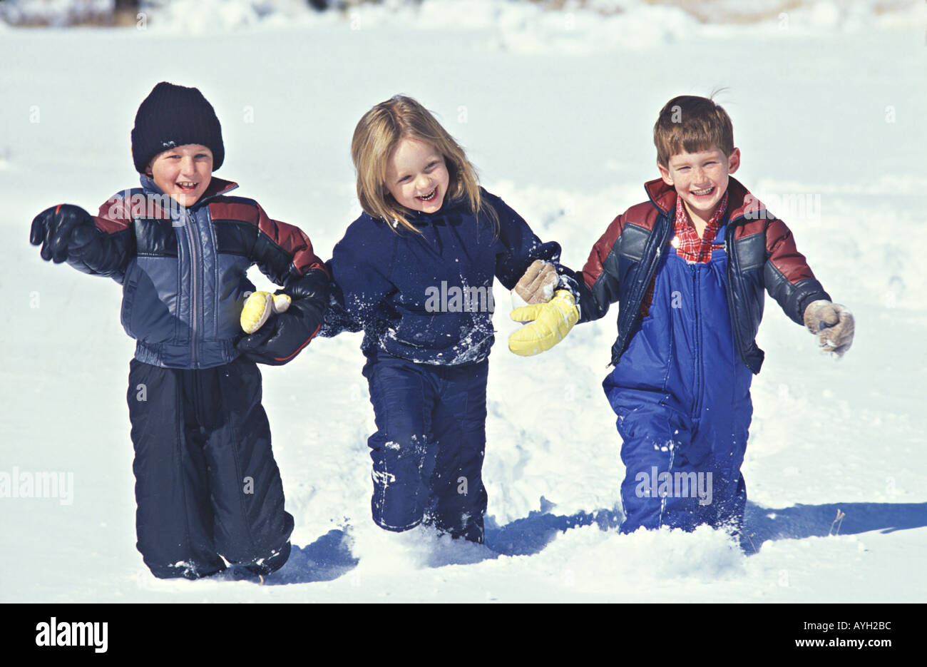 Children enjoy the results of a fresh snow storm MR Stock Photo