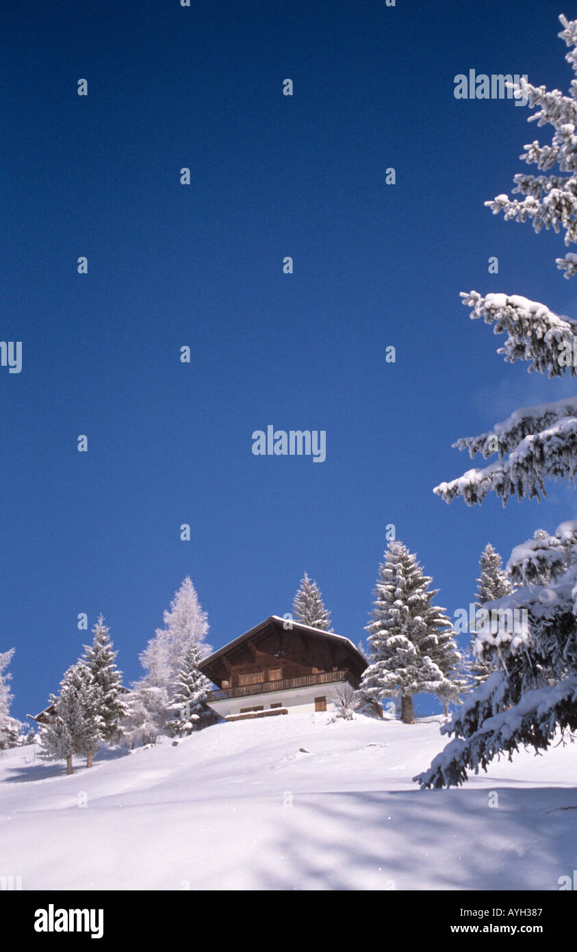 "Traditional Wooden Chalet in Swiss mountains in winter with snow and ...