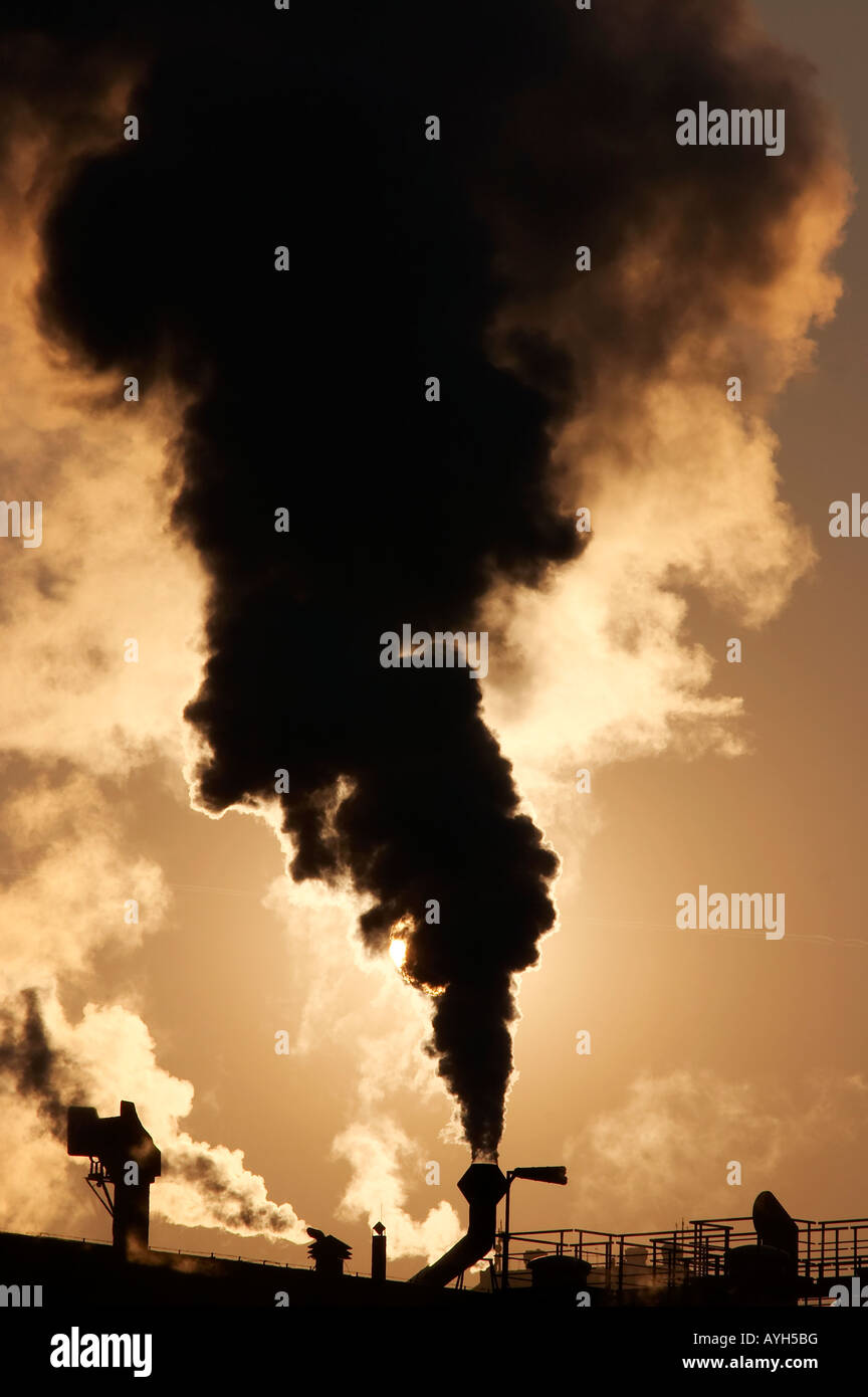global warming - gaseous air pollution covered sun Stock Photo