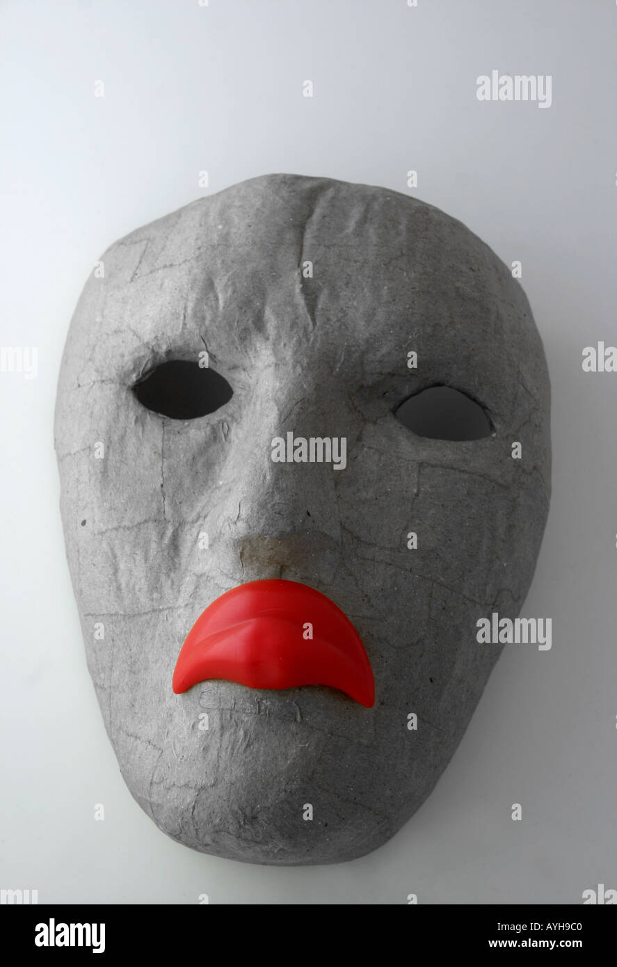 Face mask with frowning lips emphasised by colour red Stock Photo