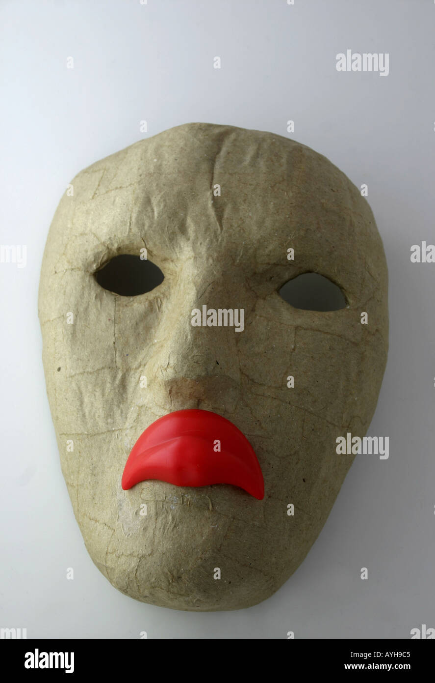 Face mask with frowning lips Stock Photo