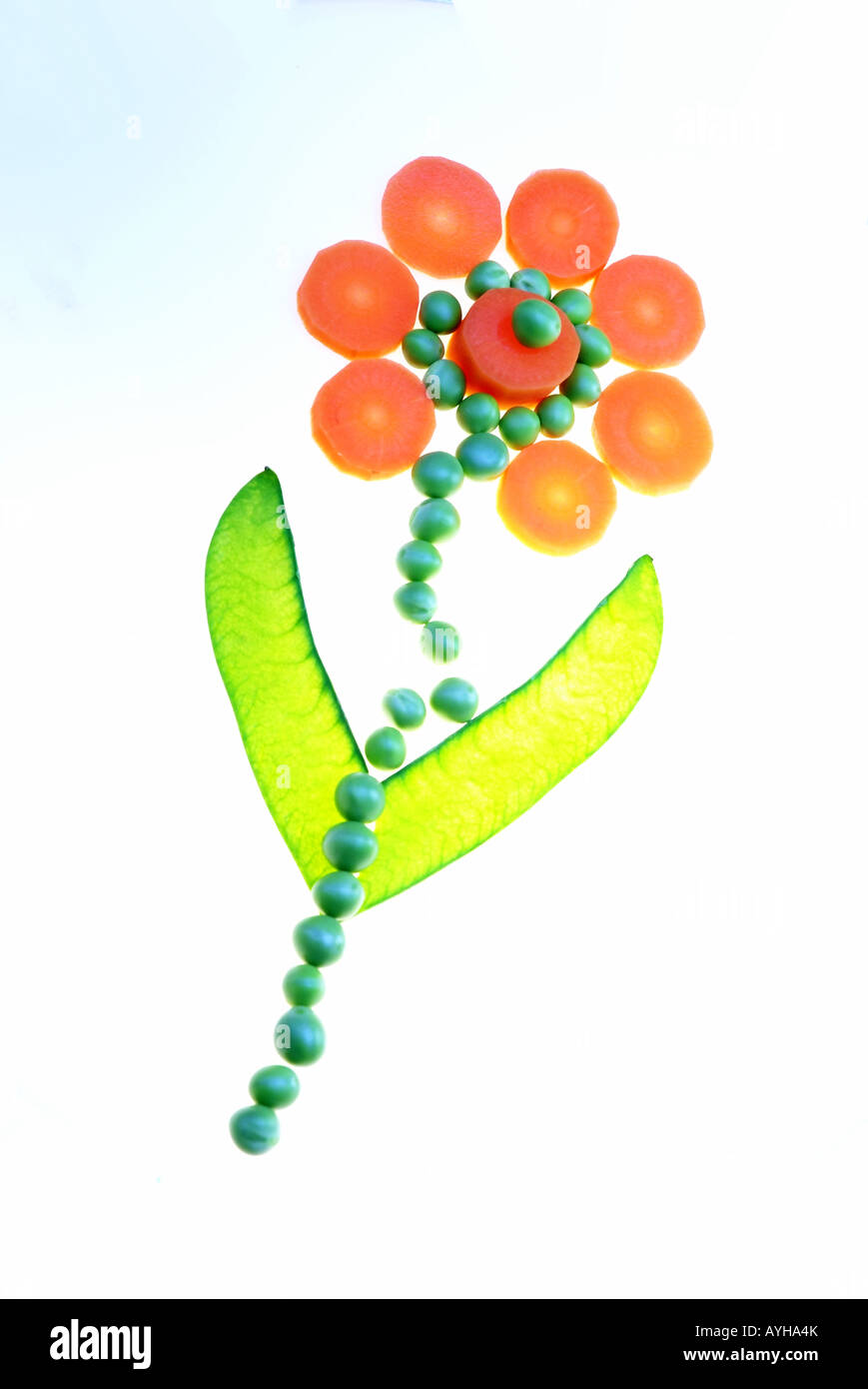 Flower made from pears and carottes | Blume aus Erbsen und Karottenscheiben Stock Photo