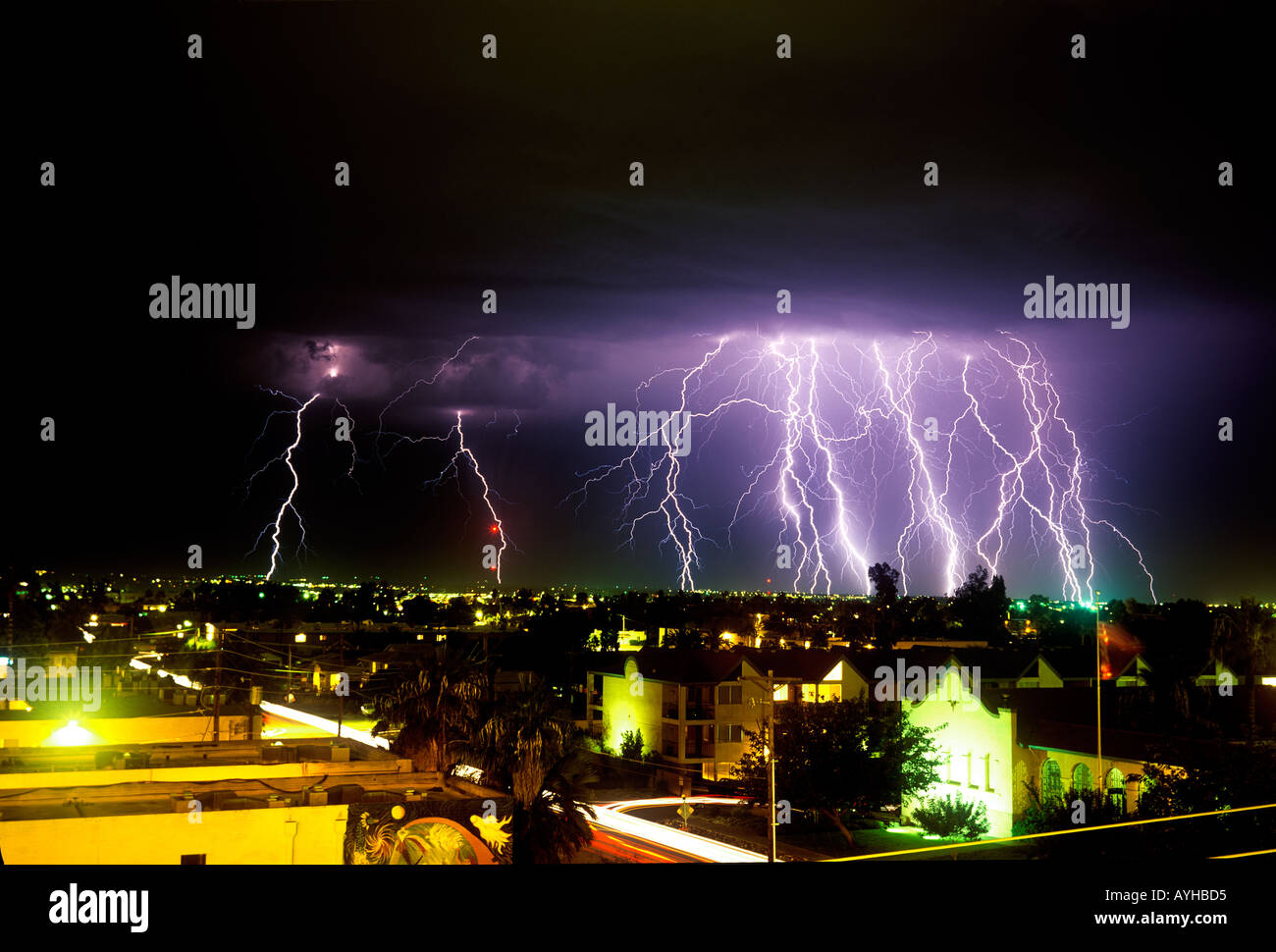 Lightning striking over the city of Tucson Arizona United States during a summer monsoon storm. Stock Photo