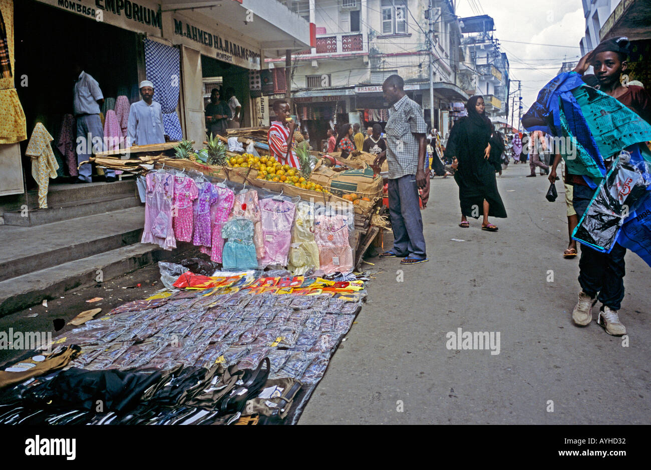 AFRICA KENYA MOMBASA Street scene in the market district of Mombasa with fruit cloth clothes all for sale Stock Photo
