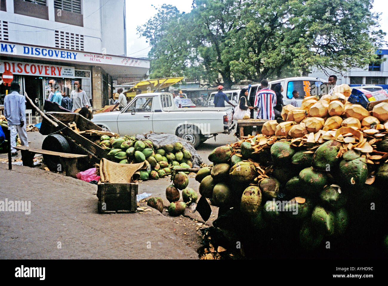AFRICA KENYA MOMBASA Piles of green coconuts for sale along the street in Mombasa Stock Photo