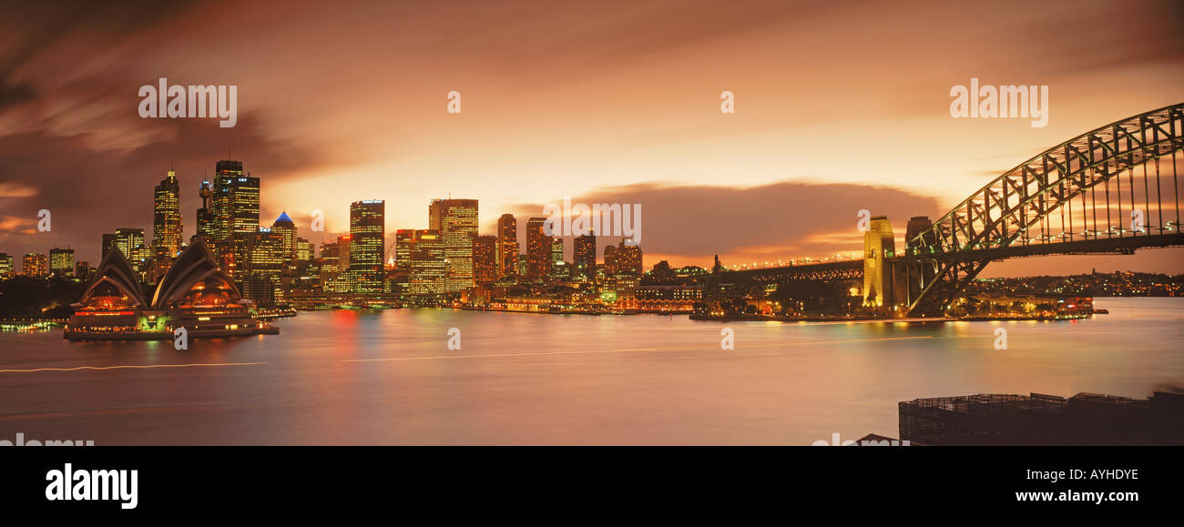 Sydney skyline with Harbour Bridge and Opera House at sunset Stock ...