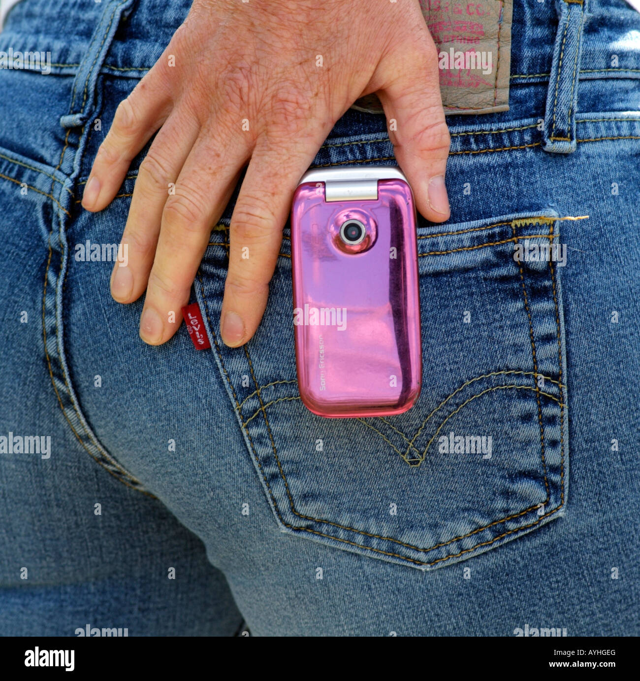 Pink Coloured Mobile Phone in Back Pocket of Ladies Levis Jeans Stock Photo  - Alamy