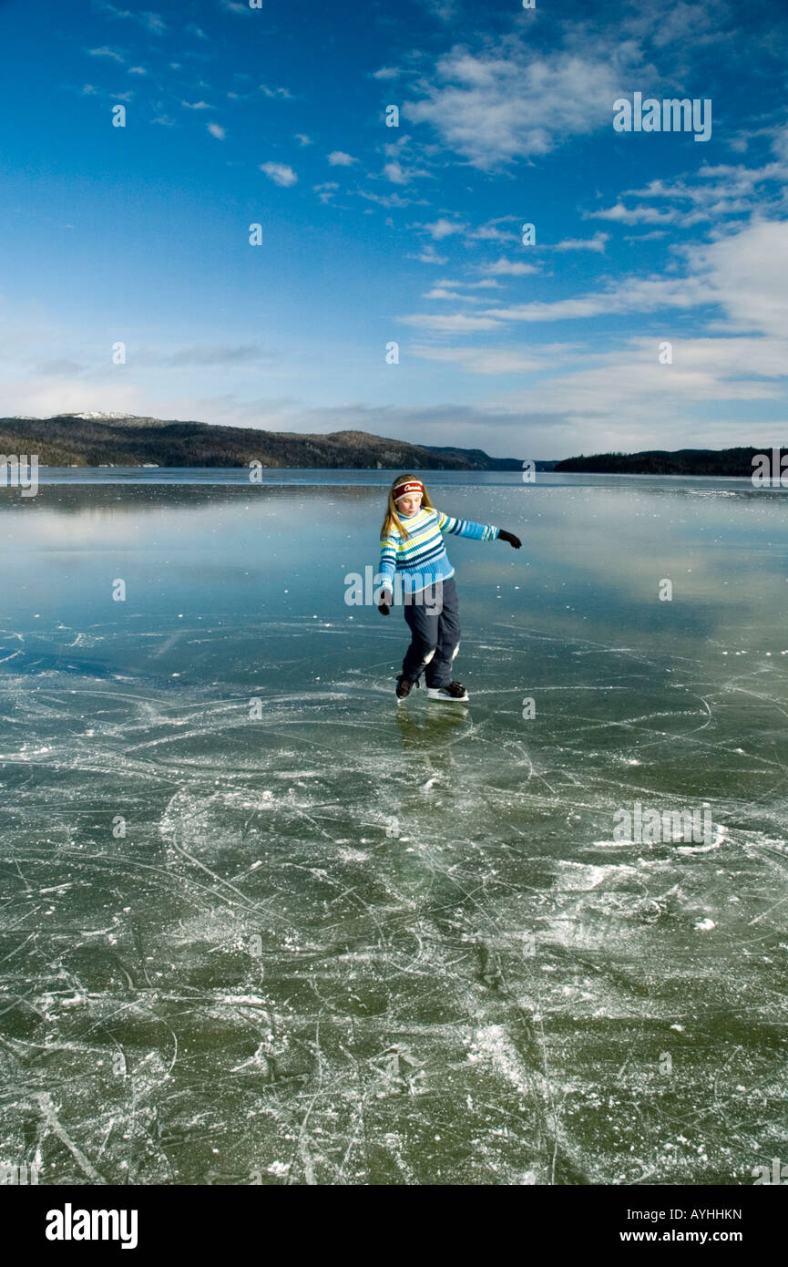 girl skating on frozen lake Stock Photo - Alamy