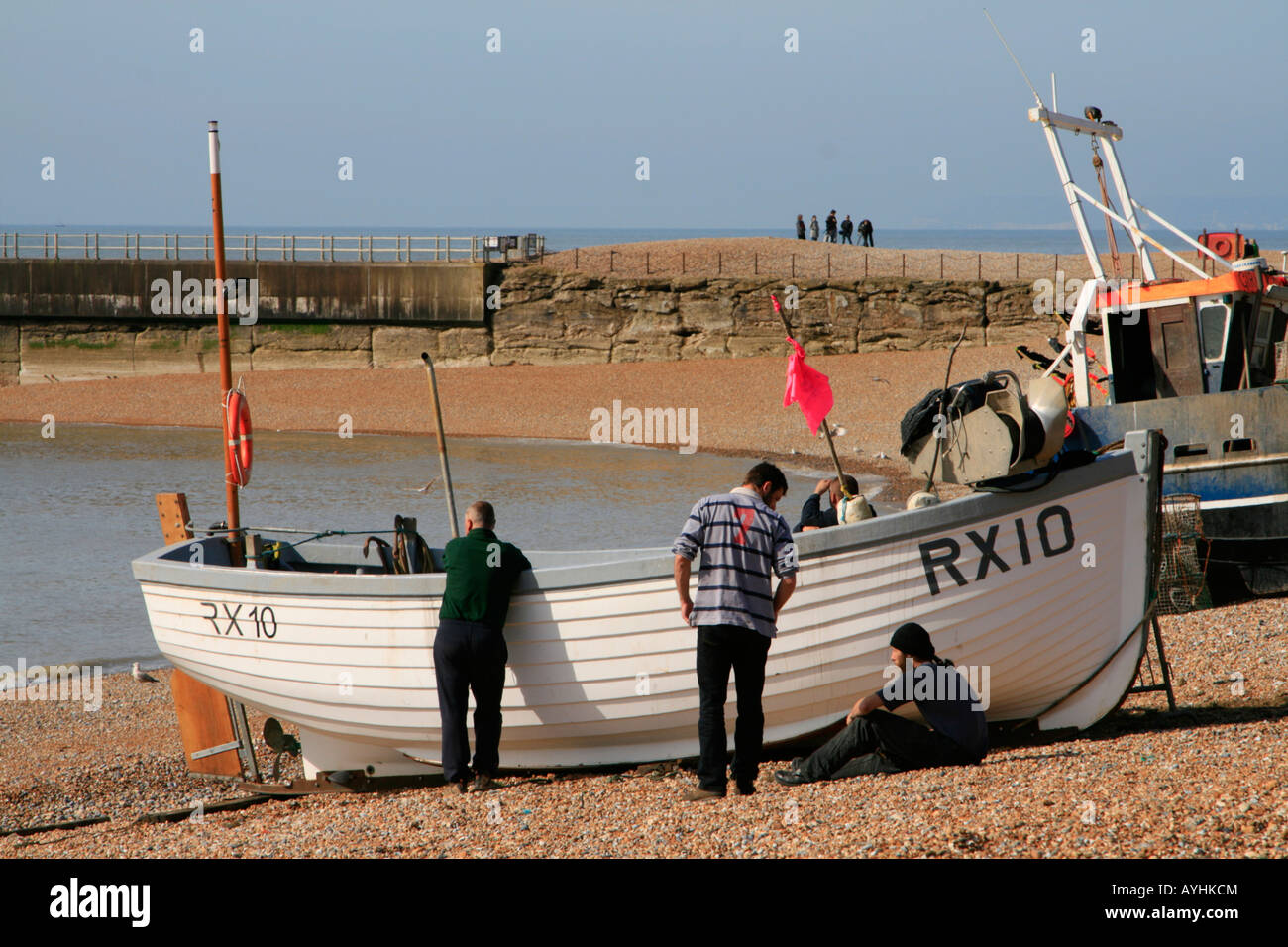 fishing boats on pebble beach at the stade or landing place hastings ...