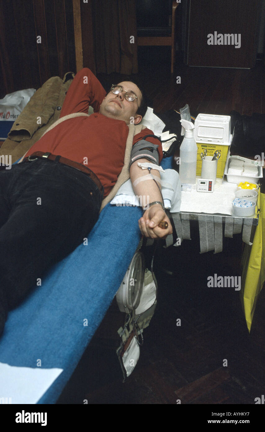young man donating blood Stock Photo