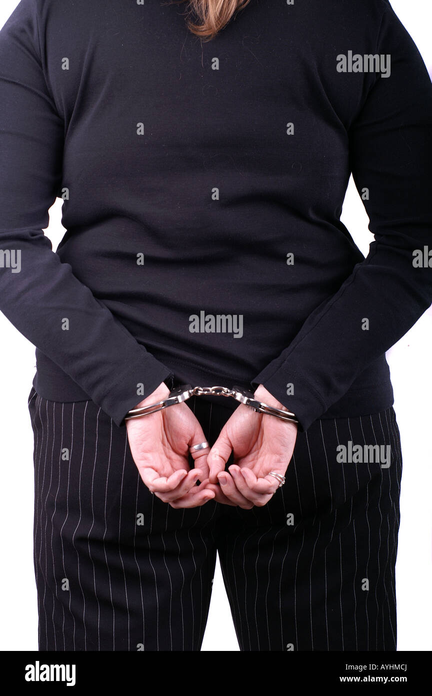Frau von hinten in Handschellen / Back of Woman Wearing Handcuffs Stock Photo